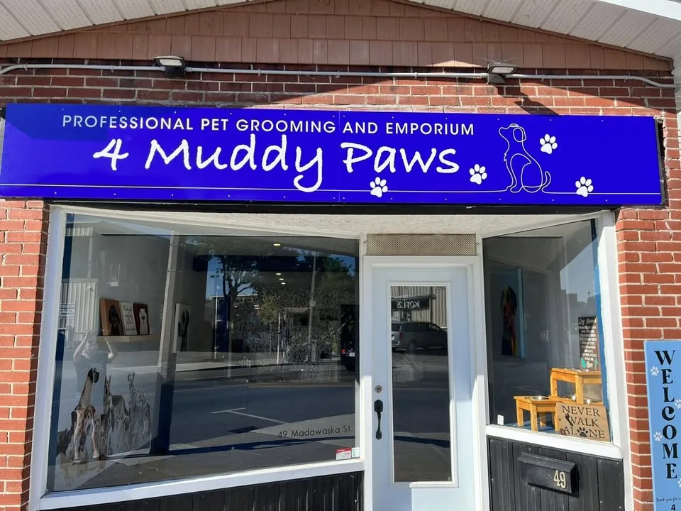 The 49 Madawaska Street storefront and its 4 Muddy Paws sign